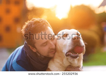 Man having fun and playing with his dog