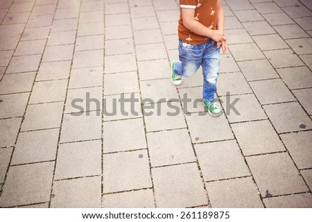 Cute little boy on a walk in the city