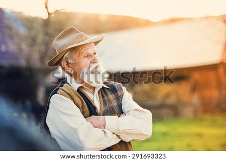 Senior farmer outside in beautiful summer nature