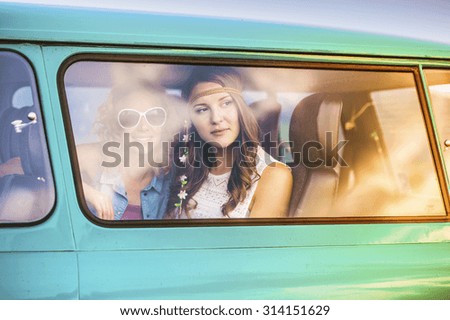 Young hipster friends on road trip on a summer day