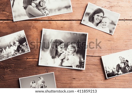 Mothers day composition. Black-and-white pictures, wooden backgr