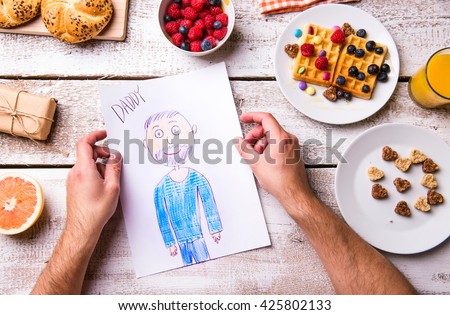 Childs drawing of her dad. Fathers day. Breakfast meal.