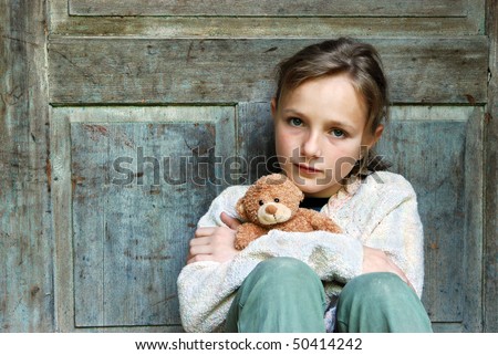 Sad little girl feels lonely.