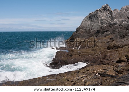 Splashing waves at Runde Island near the lighthouse (Norway)