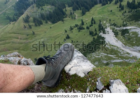 Leg with a mountaineering boot