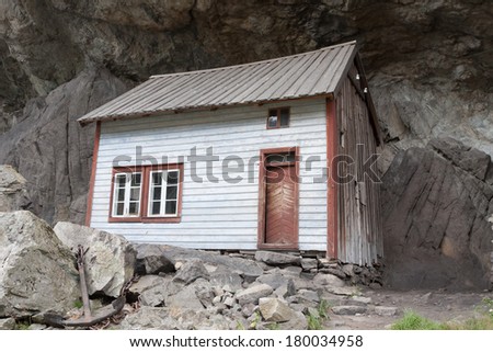Helleren (Jossingfjorden, Sokndal, Norway). Ancient houses beneath an overhanging rock (heller) along road 44.