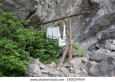 Laundry at Helleren (Jossingfjorden, Sokndal, Norway). Ancient houses beneath an overhanging rock (heller) along road 44.
