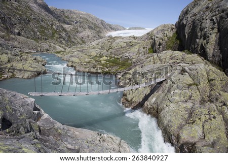 Bridge over a waterfall near Svelgabreen glacier (Folgefonna National Park, Hordaland county, Norway)