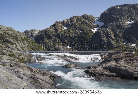 Artificial lake and waterfall near Svelgabreen glacier (Folgefonna Nasjonalpark, Hordaland, Norway)