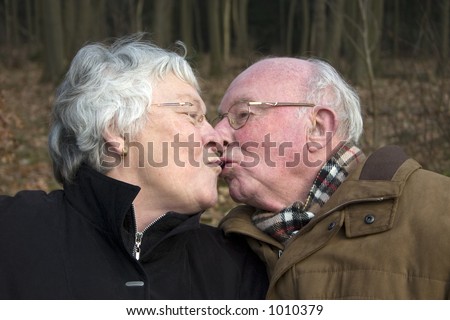 couple kissing. Elderly couple kissing