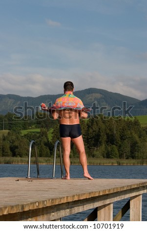 Man with a bath towel (Forggensee, Germany)