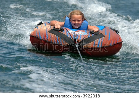 Girl Water Tubing with a Smile
