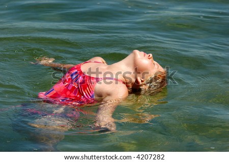stock photo Young Girl Bending Over Backward in Water