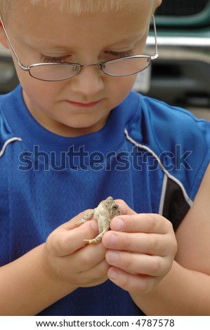 Young Student Studies Toad in Hand