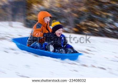 Two Excited Boys Snow Sled