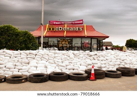 stock-photo-missouri-valley-ia-june-a-local-mcdonald-s-restaurant-is-surrounded-by-sand-bags-in-defense-79018666.jpg