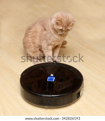 Robotic vacuum cleaner on the floor with a surprised cat