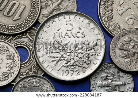 Coins of France. Olive and oak branches depicted in the old five French franc coin.