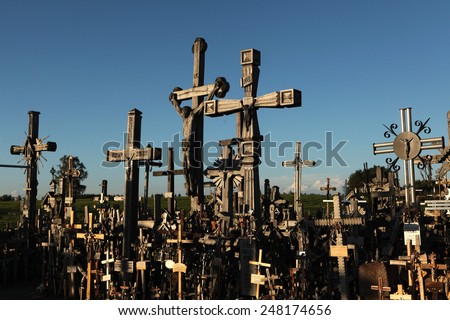 SIAULIAI, LITHUANIA - AUGUST 1, 2013: Wooden crosses at the Hill of Crosses, the most important Lithuanian Catholic pilgrimage site located near the town of Siauliai in Northern Lithuania.
