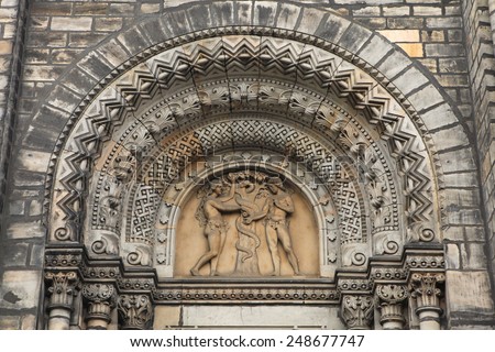 Adam and Eve. Romanesque portal of Saint Cyril and Methodius Church in Prague, Czech Republic.