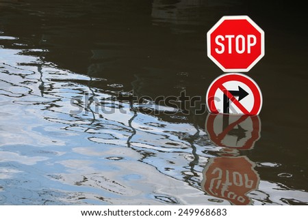 USTI NAD LABEM, CZECH REPUBLIC - JUNE 5, 2013: Stop and No right turn, traffic signs flooded by the swollen Elbe River in Usti nad Labem, Northern Bohemia, Czech Republic, on June 5, 2013.