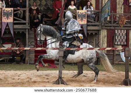MILOVICE, CZECH REPUBLIC - OCTOBER 23, 2013: Actor dressed as a medieval knight rides a horse during the filming of the new movie The Knights near Milovice, Czech Republic.