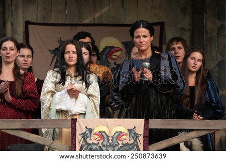 MILOVICE, CZECH REPUBLIC - OCTOBER 23, 2013: Background actors dressed as medieval nobles attend the filming of the new movie The Knights directed by Carsten Gutschmidt near Milovice, Czech Republic.