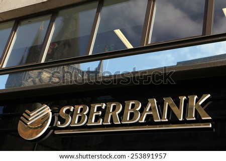 PRAGUE, CZECH REPUBLIC - MARCH 20, 2013: Sign of a new opened flagship branch of Sberbank in Prague, Czech Republic. Sberbank, the largest bank in Russia, started operations in Europe.