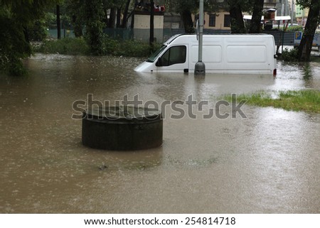 PRAGUE, CZECH REPUBLIC - JUNE 3, 2013: Minivan vehicle flooded by the swollen Vltava River in Prague, Czech Republic.