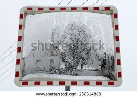 Winter landscape reflecting in the convex mirror in Central Bohemia, Czech Republic.