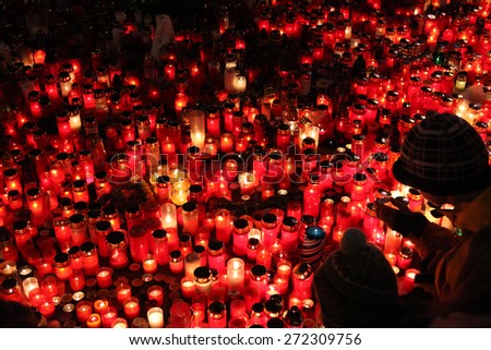 PRAGUE, CZECH REPUBLIC - DECEMBER 22, 2011: People light candles in memoriam late Czech president Vaclav Havel in Wenceslas square in Prague, Czech Republic.