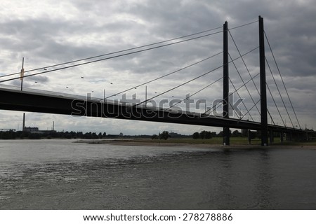 DUSSELDORF, GERMANY - AUGUST 6, 2012: Bridge over the Rhine River in Dusseldorf, North Rhine-Westphalia, Germany.
