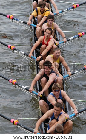 Junior rowing team rowing ahead during a boat-race on the River Vltava in Prague, Czech Republic.