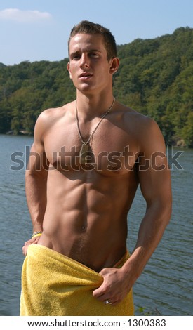 Muscular male model wrapped in a towel