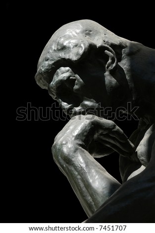 The Thinker, famous statue by Auguste Rodin, isolated on black