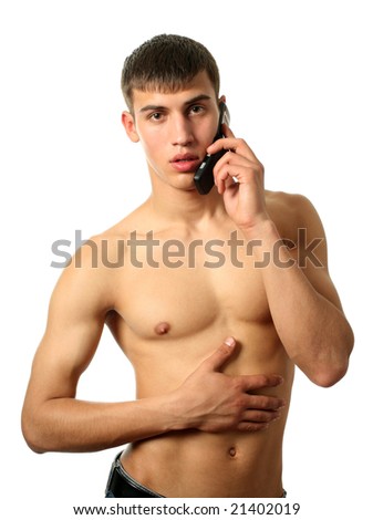 stock photo Young muscular sexy man calling on cell phone isolated on