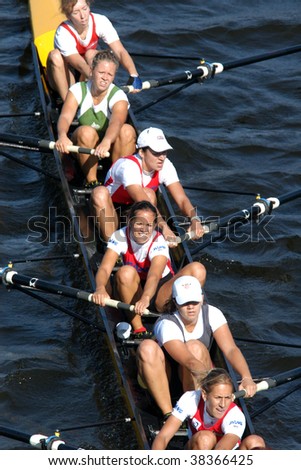 PRAGUE - June 6: Female rowing team rowing ahead during a boat-race in Prague, Czech Republic, on June 6, 2009