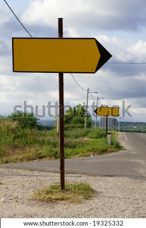 Road signs showing opposite directions. Picture taken on the regional road between Belgrade and Mladenovac, Serbia.