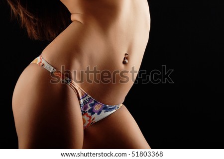 stock photo : Sexy female in bikini with a pierced belly button.