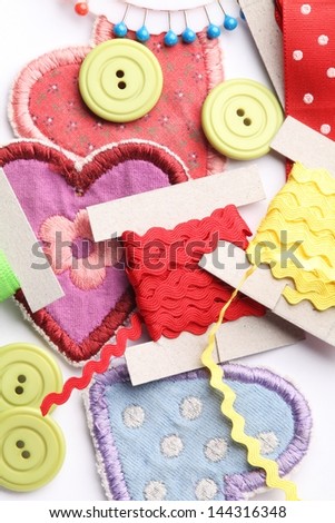 Top view of sewing items on white background