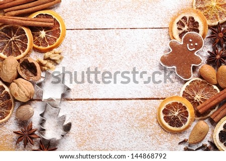 Top view of wooden board with Christmas baking ingredients.