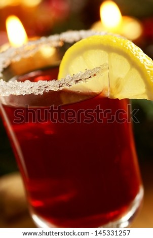 Rimmed glass with sugar and spicy tea.
