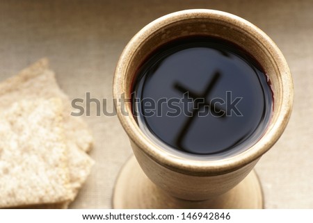 Chalice with wine and bread Cross shadow in the chalice Chalice with wine and bread Cross shadow in the chalice