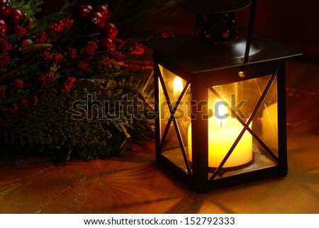 Lantern  with burning candle in dark