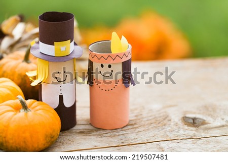 Pilgrim and Indian decorations on a wooden table Pilgrim and Indian decorations on a wooden table