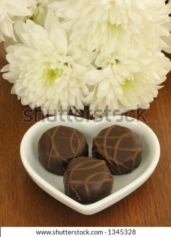Chocolate candies and flowers