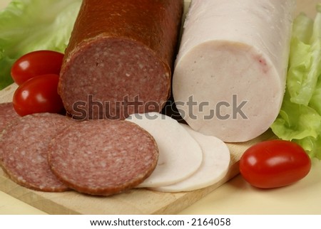 Two kinds of salami and fresh vegetables