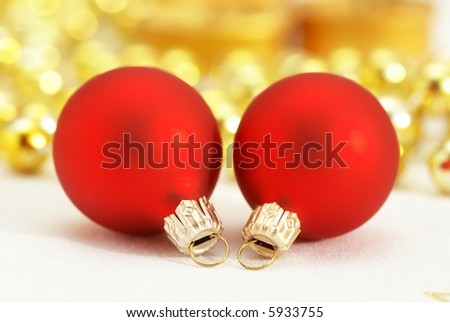 Red christmas ornaments and shiny golden decorations - focus on ornaments, shallow DOF