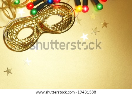 Holiday background with carnival mask and christmas lights