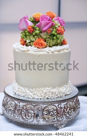 stock photo Beautiful wedding cake topper with multiple flowers